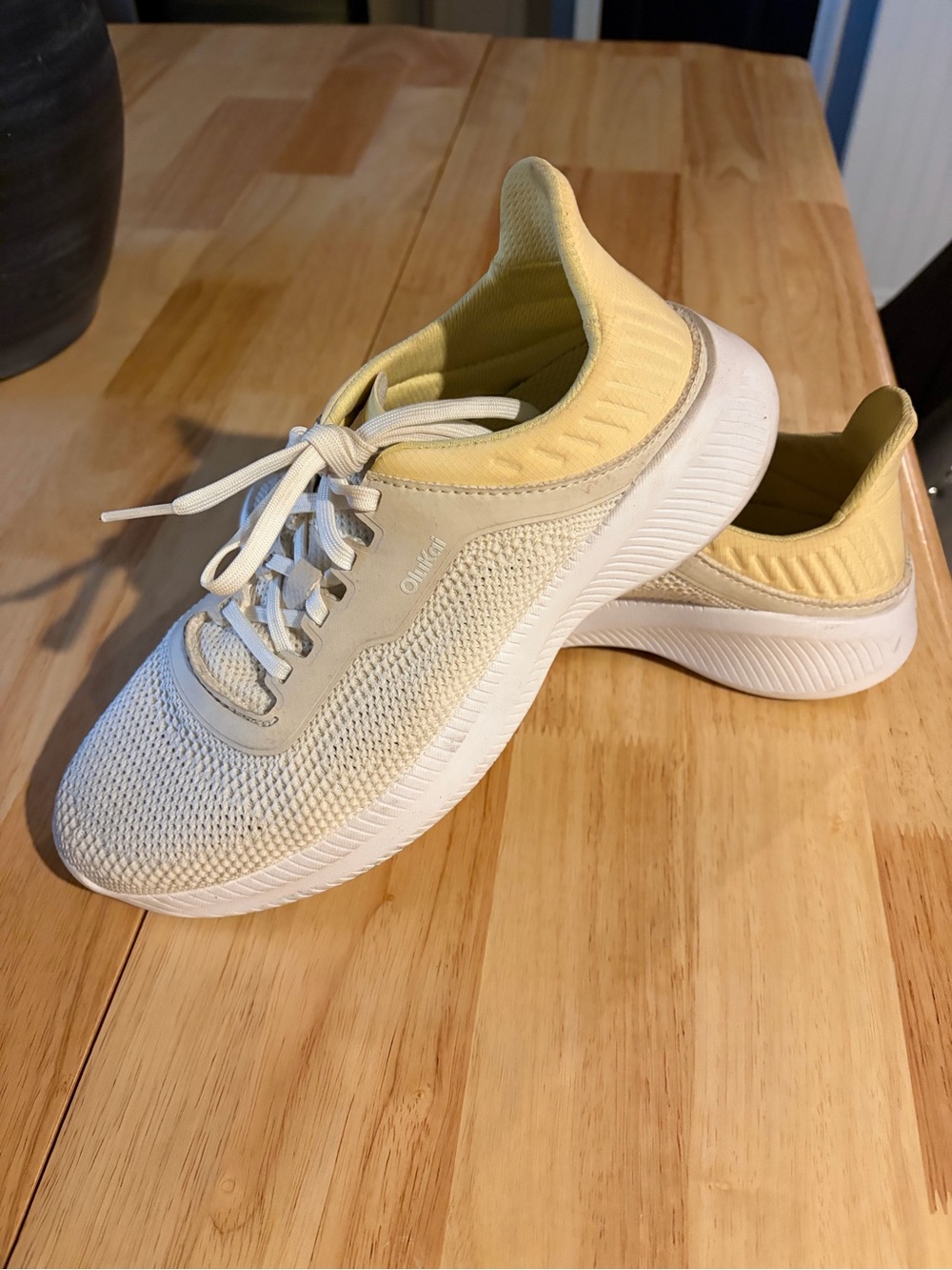 OluKai Women’s Knit Sneakers in Pale Yellow and White